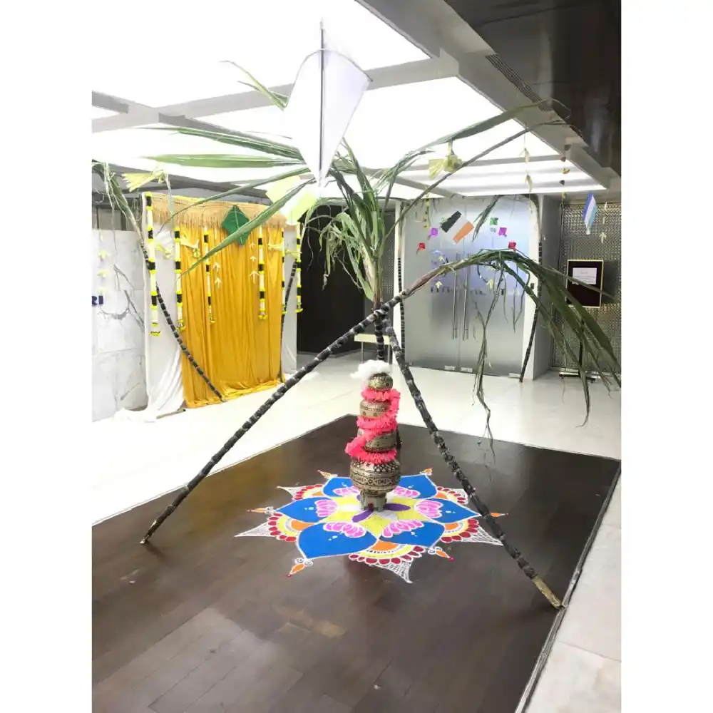 Pongal office decoration with rangoli and props